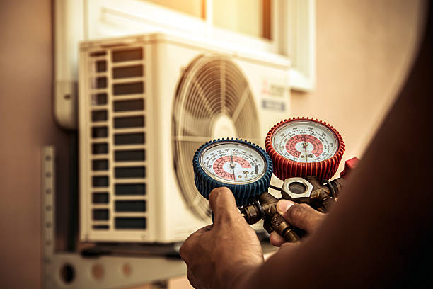Professional Air Conditioning Service technician working in Fairfield, FL